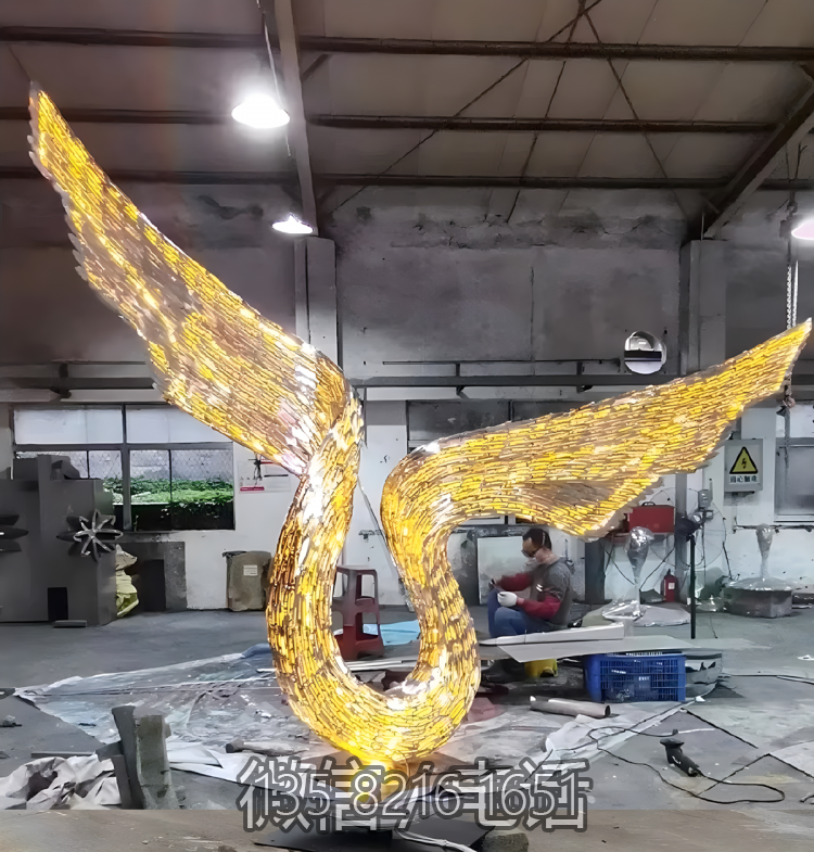 鏤空發(fā)光不銹鋼抽象翅膀雕塑